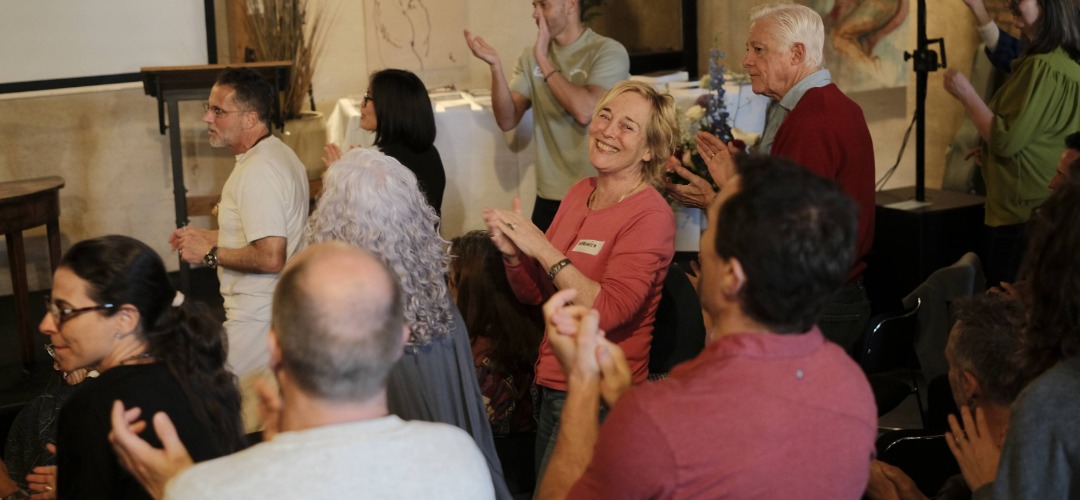 Participants clapping and celebrating together