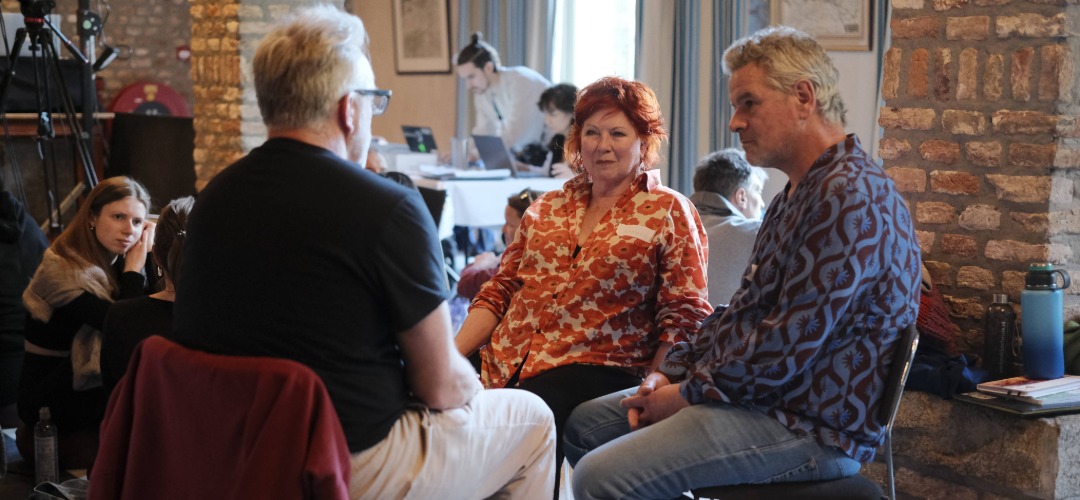 Small group in intimate conversation